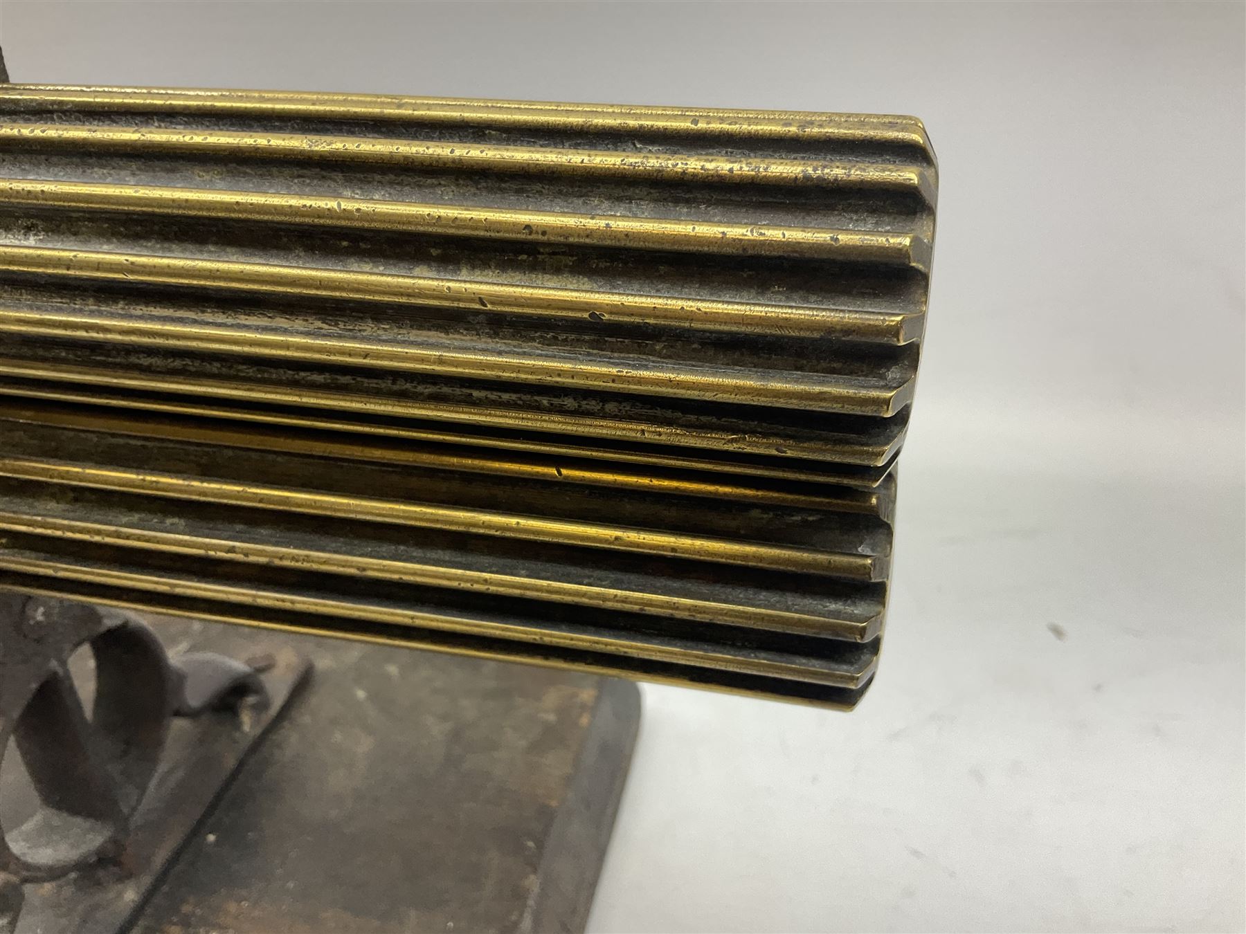 Victorian cuff and collar tabletop mangle, the ribbed brass rollers in a cast iron frame mounted on a wooden base