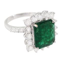 18ct white gold octagonal cut emerald and round brilliant cut diamond cluster ring, with diamond set shoulders, emerald 4.64 carat, total diamond weight 1.80 carat, with World Gemological Institute report