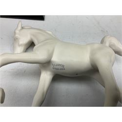 Five Beswick and Royal Doulton horse figures in matt white on black plinths, comprising of  Spirit of Affection no. 2689/2536, Springtime no.2837, Spirit of peace no.2916, Spirit of earth no.2914 and Spirit of the wild no. 183, together with a composite figure of a horse (6)
