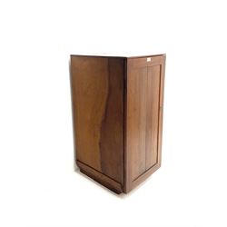 Hardwood single door cabinet, enclosing six drawers, platform supports 