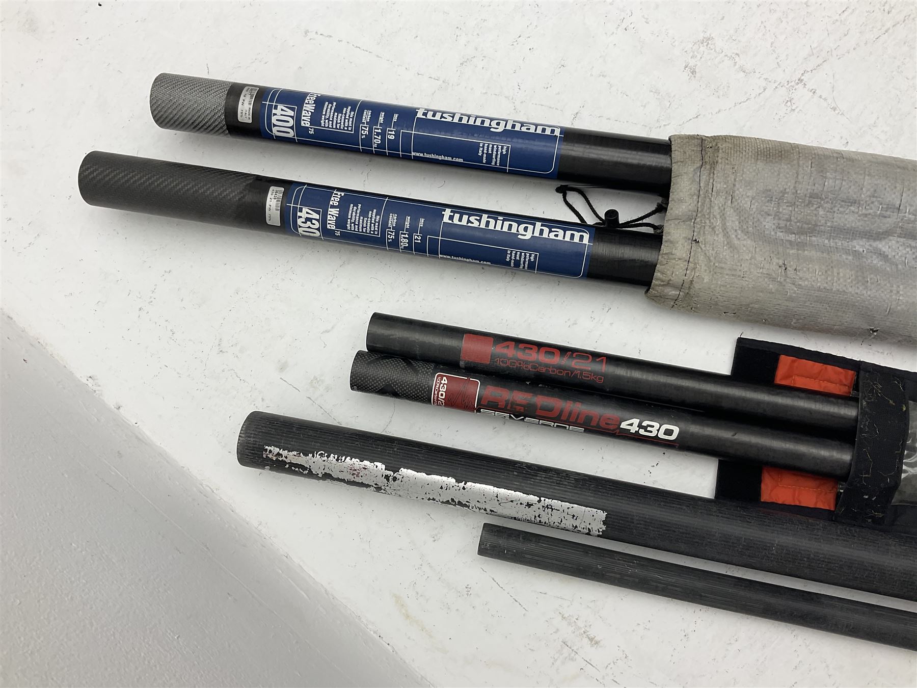 Windsurfing: Quantity of sails and masts comprising Severne Gator sail, mast 430/21 size 6.0, luff 453, boom 182, carbon Redline Severne 430 RDM mast, Tushingham Rock sail and Tushingham Free Wave mast, Tunshingham The Rock 4.2 sail, some with carrying cases, together with other equipment to include Severne Wave Grenade extension, other extensions etc