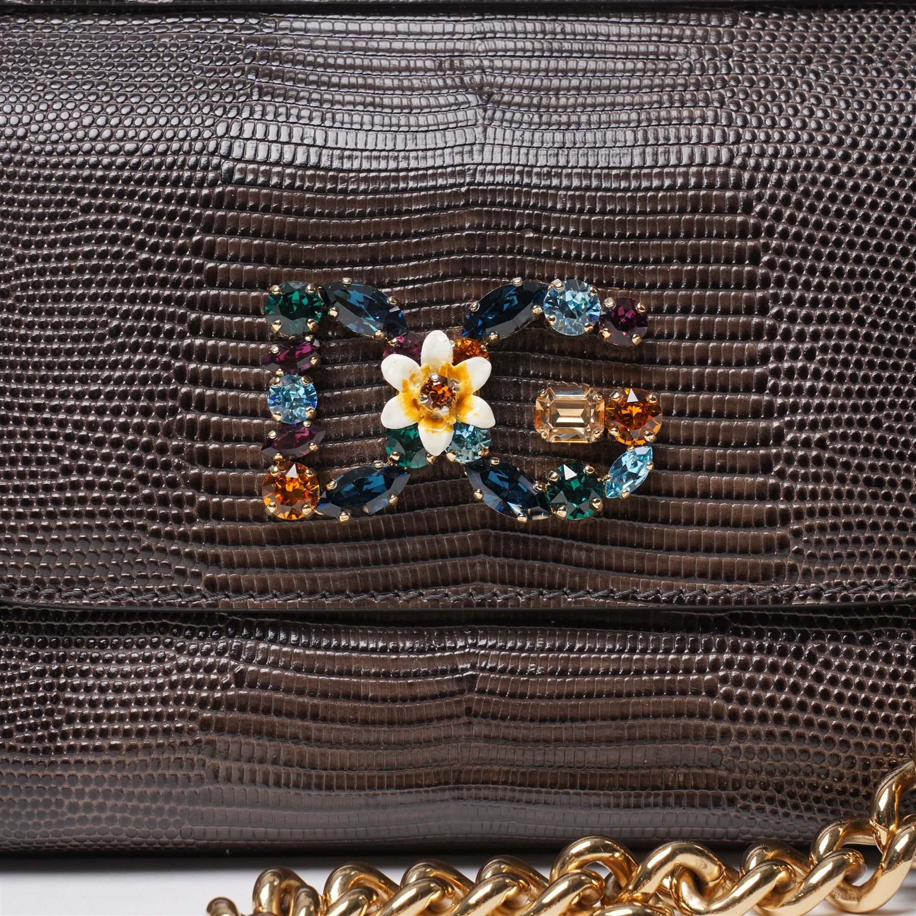 Dolce & Gabbana - ‘Miss Sicily’ Jewelled Mini Shoulder Bag, the model introduced for the Fall/Winter 2017/2018 collection, in structured brown iguana-print calfskin leather, the front applied with a multicoloured crystal-set DG monogram logo incorporating floral motif, with detachable gold-tone chain shoulder strap, unused with original dust bag and tags