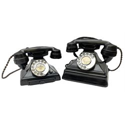 Two black Bakelite telephones of pyramid form with rotary dials, comprising The Telephone Demonstration Set model. 6al with base drawer and light bulb, and another larger with G.P.O FWR 58/2 stamped marks beneath, largest H18cm W20cm D16cm