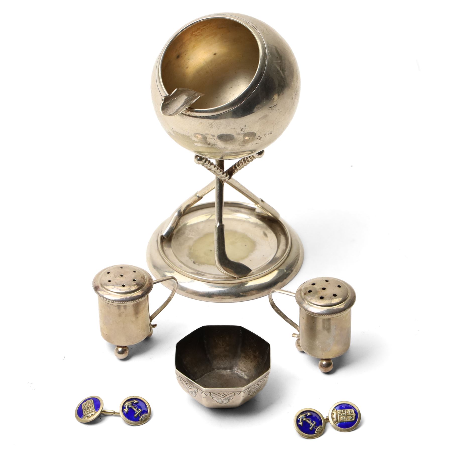 Pair of Swedish silver pepperettes with loop handles, small Middle Eastern silver octagonal salt, unmarked but tests 94 standard, pair of silver gilt and enamel cufflinks and a plated ashtray with golfing motifs