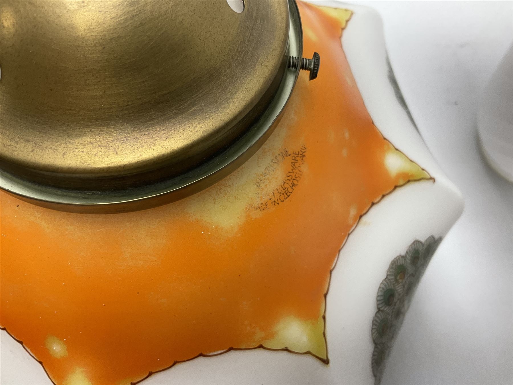 Milk glass lampshade decorated with peacocks, together with a Tiffany style lampshade, a set of five white frilled lamps shades etc 