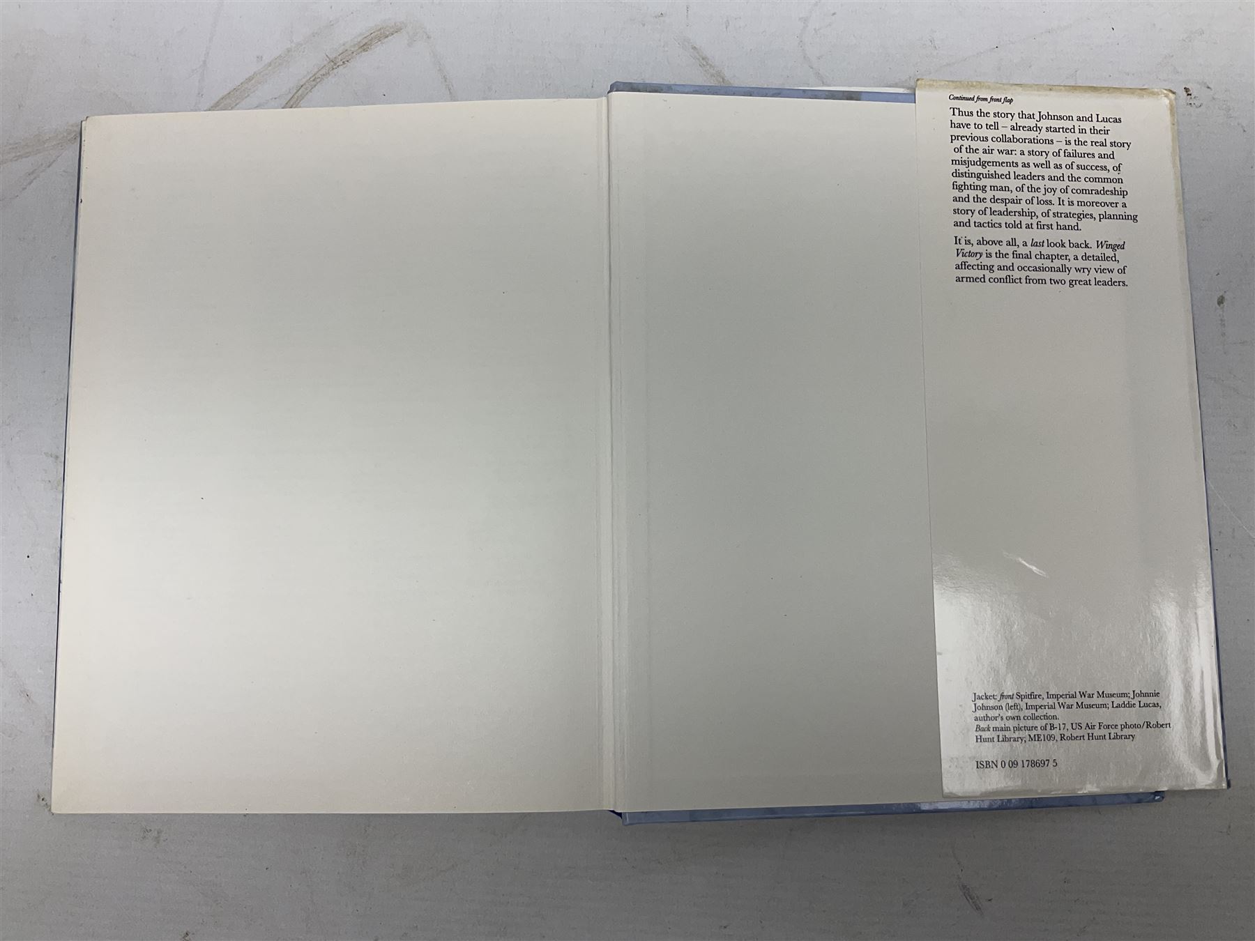 Winged Victory. 1995. Loose mounted signed dedication note and bookplate on the fep from the authors Wing Commander P.B. (Laddie) Lucas and Air Vice-Marshall J.E. (Johnnie) Johnson with duplicate signatures on the title page. Unclipped dustjacket.
