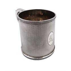 1920s silver christening mug, of slightly tapering cylindrical form, with engine turned decoration and engraved oval cartouche, hallmarked Ollivant & Botsford, Birmingham 1928, H8cm
