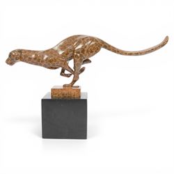 Sprinting Cheetah, bronze two toned figure of running cheetah, upon a rectangular marble b...