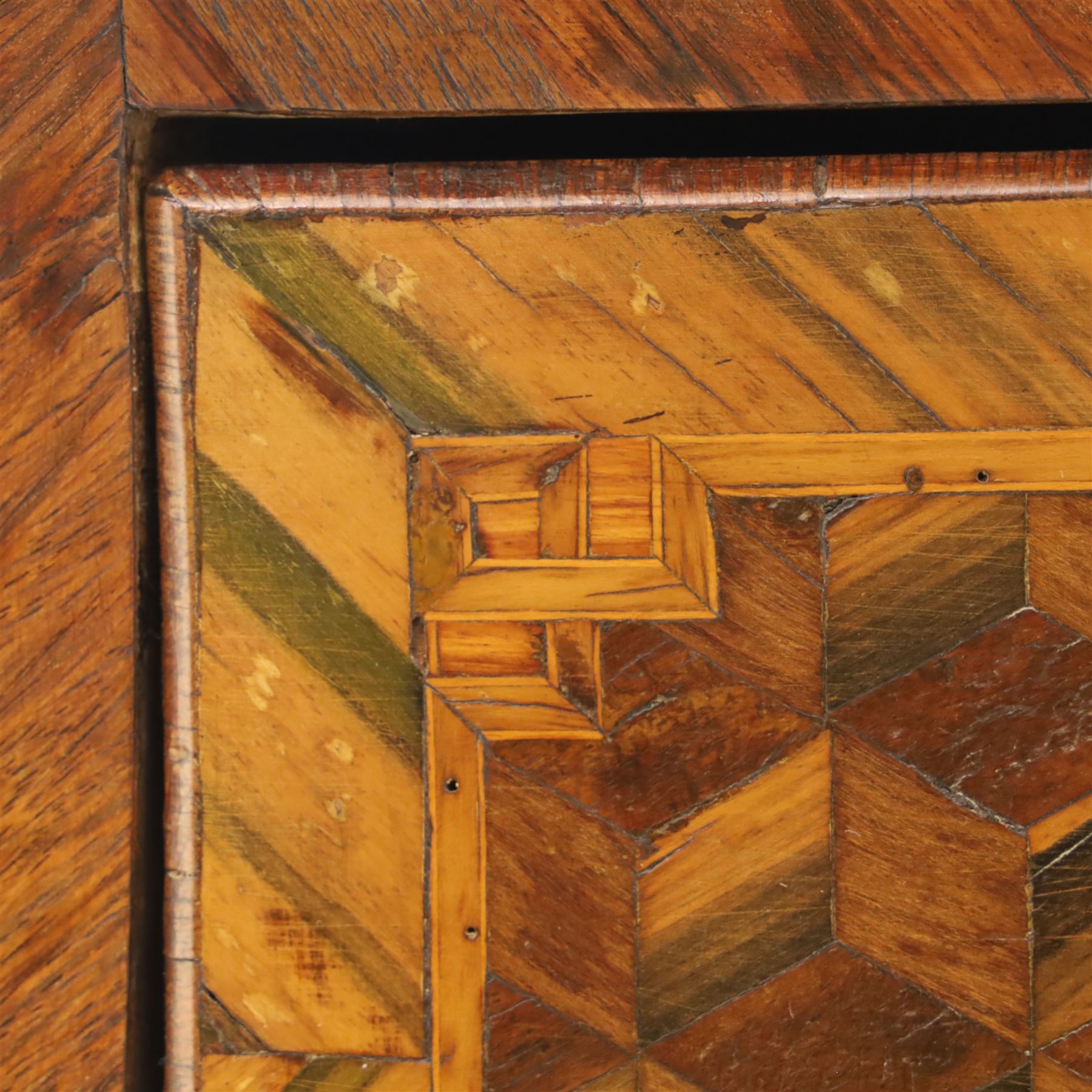 Late 18th-century Louis XV kingwood marquetry commode, rectangular top with original serpentine Breche marble top, above two long crossbanded drawers with rococo style gilt bronze handles and escutcheons in marquetry framed panel in various woods, shaped and centered apron with gilt bronze foliate mounts, sides and drawer fronts with cube geometric marquetry design, on slender cabriole legs with gilt bronze sabots  