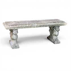 Ornate weathered cast stone rectangular garden bench, raised on winged griffin supports, square plinth bases
