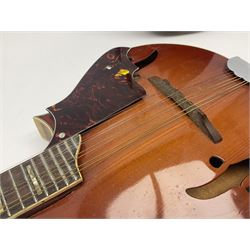 Eastern eight-string mandolin with sunburst finish and mother-of-pearl inlay L68.5cm; and another Harmony mandolin with cracked headstock (2)