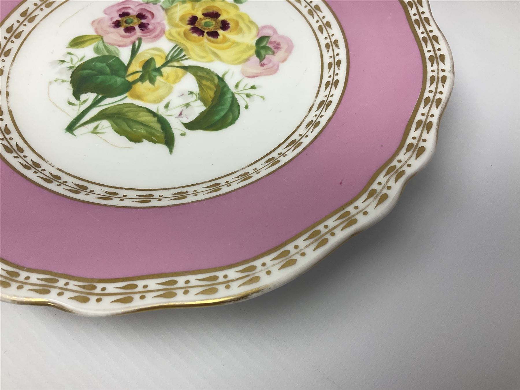 Victorian Copeland, Botanical dessert service, decorated with floral sprigs to the centre with a pink and gilt border, comprising five comports and seven plates, largest comport H20cm, plate D22cm