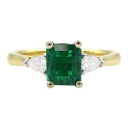 18ct gold three stone emerald and pear cut diamond ring, hallmarked, emerald approx 0.85 carat