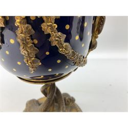 French Sevres ormolu mounted vase and cover, the bowl detailed in gilt with dots and scrolls upon a gros bleu ground, with ormolu mounted twin handles and swags, upon a stem modelled as three entwined dolphins and a circular base with beaded edge, overall H20.5cm