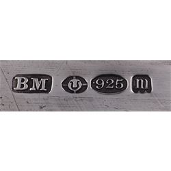 Late 19th century German Hanau silver box, of shaped rectangular form, embossed throughout, the hinged cover decorated with a central oval panel depicting a genre scene with musicians, the corners detailed with masks, the sides detailed with conforming figures and musical trophies, opening to reveal a gilt interior, with Hanau marks for Neresheimer & Sohne, and hallmarked B Muller & Son, London import 1907, approximate weight 3.32 ozt (103.4 grams)