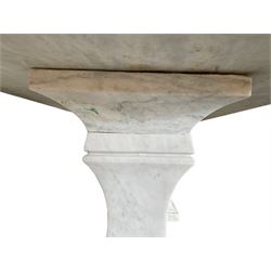 Classical Grecian design Carrera marble centre table, the rectangular single slab top with rounded corners and carved edge, raised on twin pedestals comprised of three pieces with a waisted column on a stepped plinth