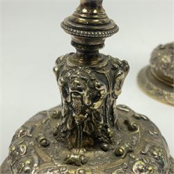 Pair of Victorian Elkington Mason & Co silver plated candlesticks, decorated in relief with ram masks and figures, H14cm