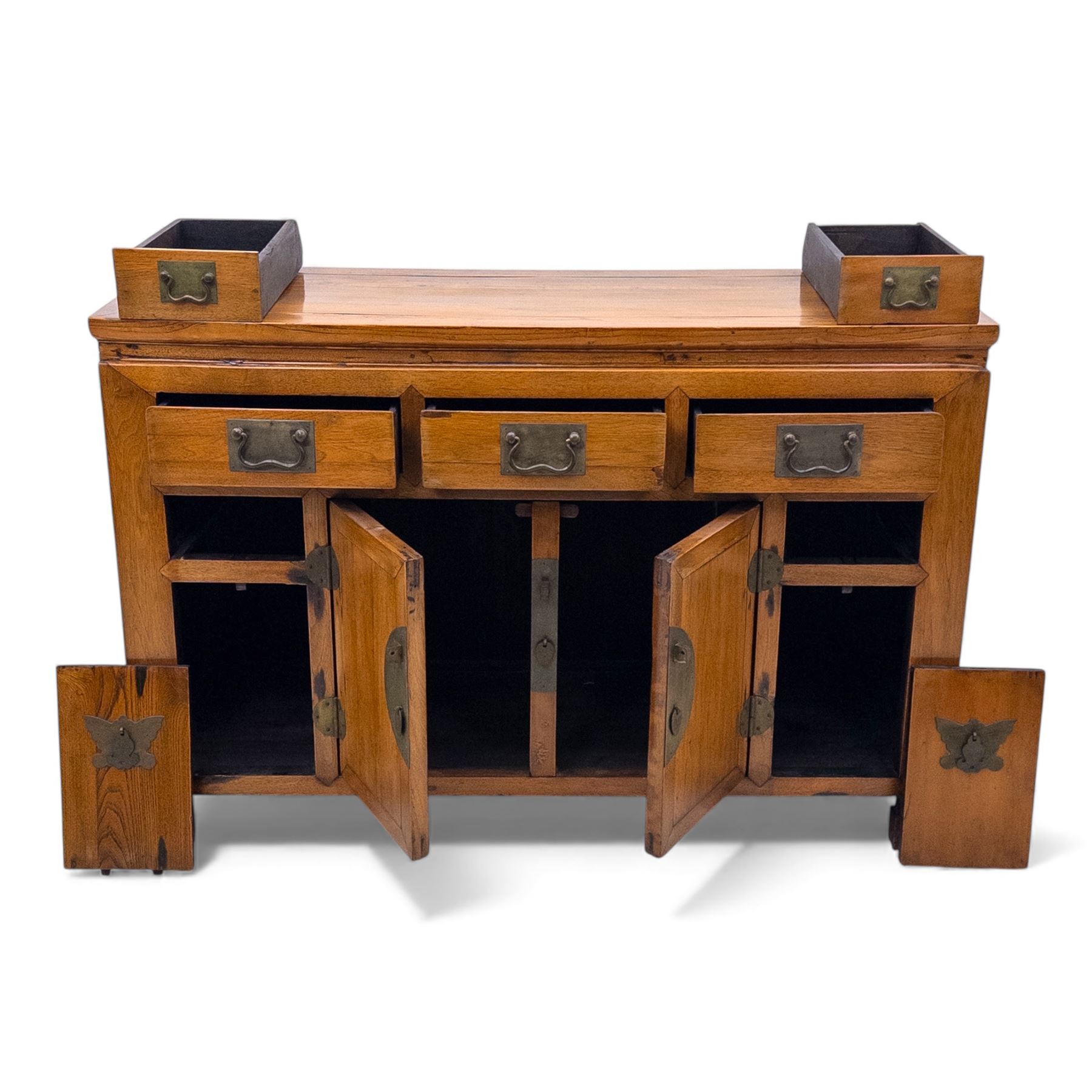 Late 20th-century Thai elm sideboard fitted with an arrangement of three drawers over a central cupboard flanked by a further two drawers, raised on square post feet 