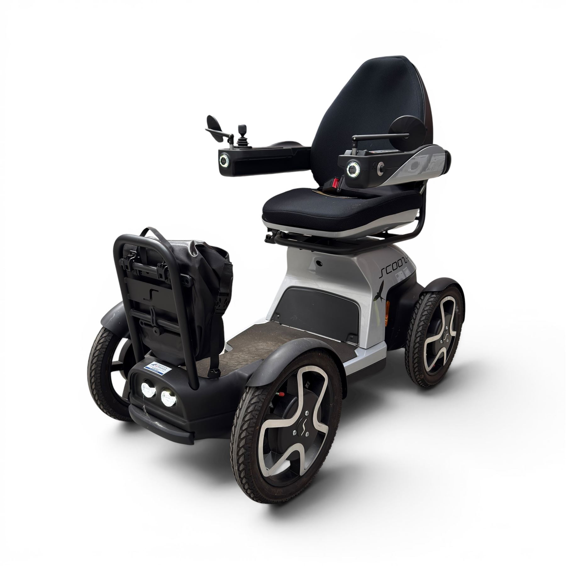 TGA Scoozy - mobility scooter, four wheel model with joystick controls, front storage bag, lights and grey and black bodywork.
