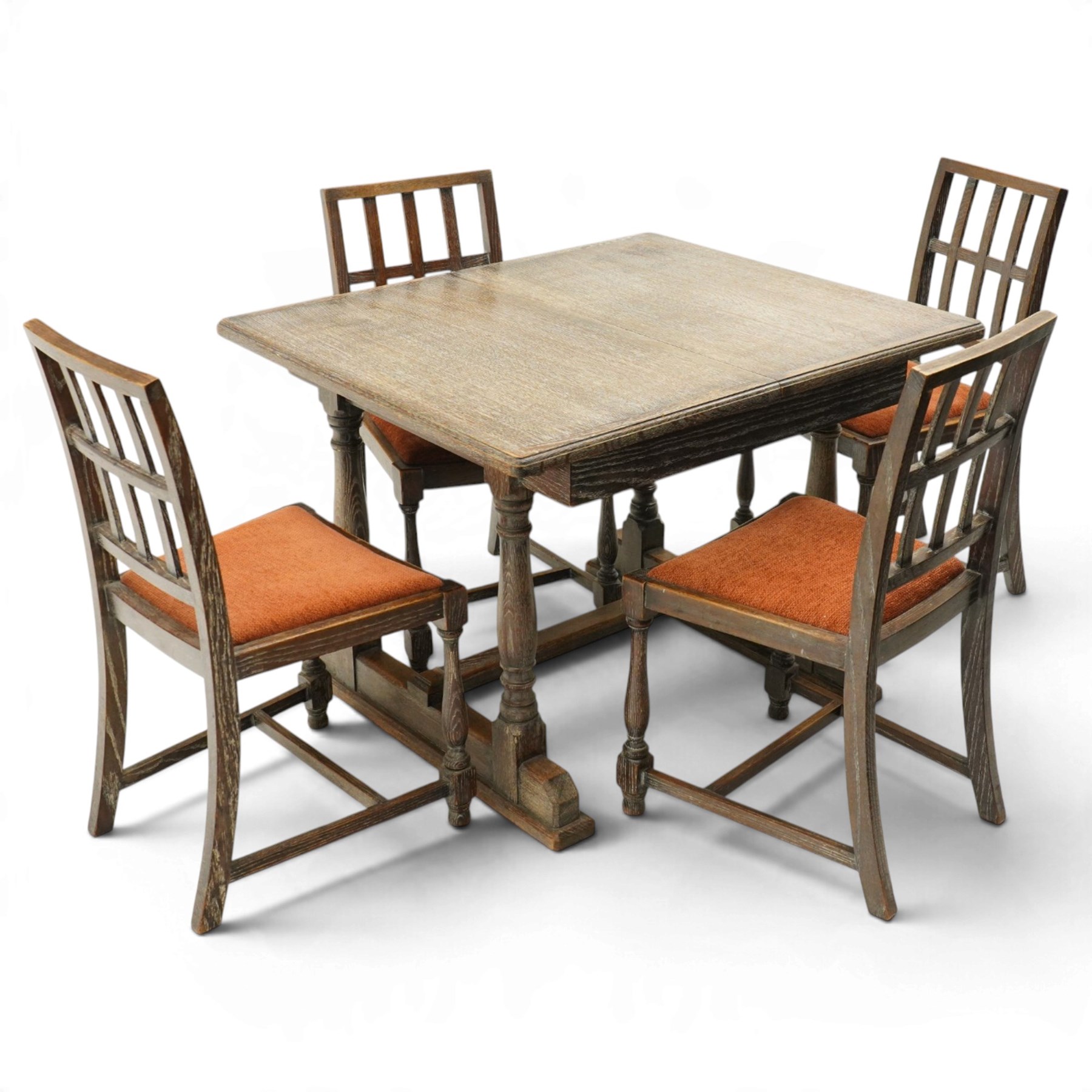 Arts & Crafts limed oak extending dining table, the rectangular draw-leaf top with integral leaf, raised on four turned supports united by H-stretcher; with set four matching lattice-back chairs on turned front-supports (W47cm H89cm)