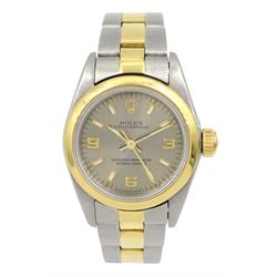 Rolex Oyster Perpetual ladies gold and stainless steel wristwatch, circa 1997, Ref. 67483, bronze/golden sunburst dial, on Oyster gold and stainless steel strap, with fold-over clasp