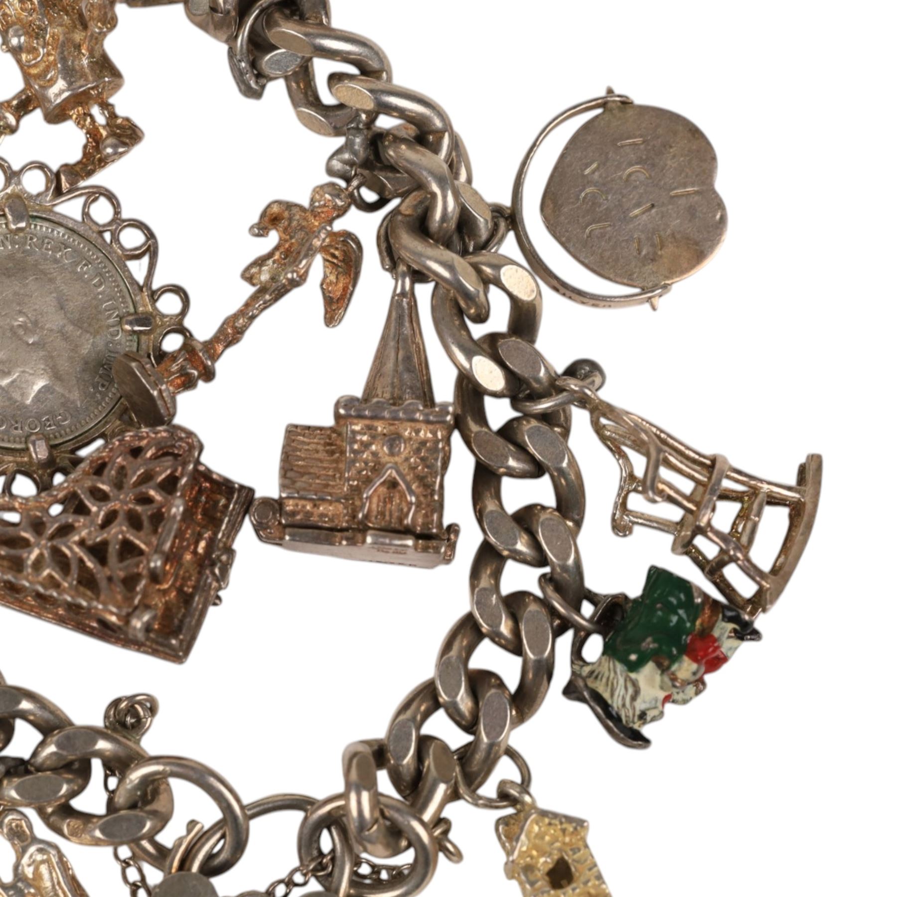 Silver charm bracelet, with seventeen charms including motorbike helmet, enamel toby jug, piano, etc