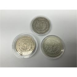 Three United States of America silver Morgan dollar coins dated 1881 O, 1882 and 1882 O