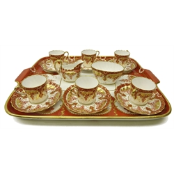  Late Victorian Spode Copeland cabaret set for six persons, comprising six fluted coffee cups and saucers, decorated with trailing flowers on iron red ground and gilding on a rectangular twin handed tray, pattern no.5535, L44cm x W35cm   