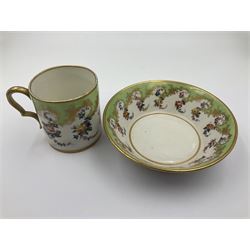 Sèvres soft paste porcelain coffee can and saucer with date code for 1754, painted and gilded with flowers, dangling from the shaped green border, interlaced LL monogram enclosing the date letter A above painters mark for Dodin, coffee can H7cm, saucer D14.5cm