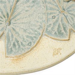 Bernard Rooke (1938-) - Studio pottery dish of shaped oval form with a raised pattern of lily pads and frogs W29cm with Bernard Rooke paper label and purchased from The Mill Gallery, Swilland, Ipswich and inscribed 'B R'