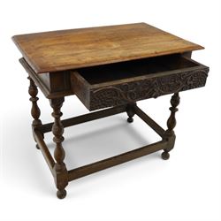 18th century oak lowboy, rectangular top with moulded edge, fitted with single frieze drawer carved with scrolling fruiting vines and stylised plant motifs, raised on bobbin-turned supports united by box stretcher 