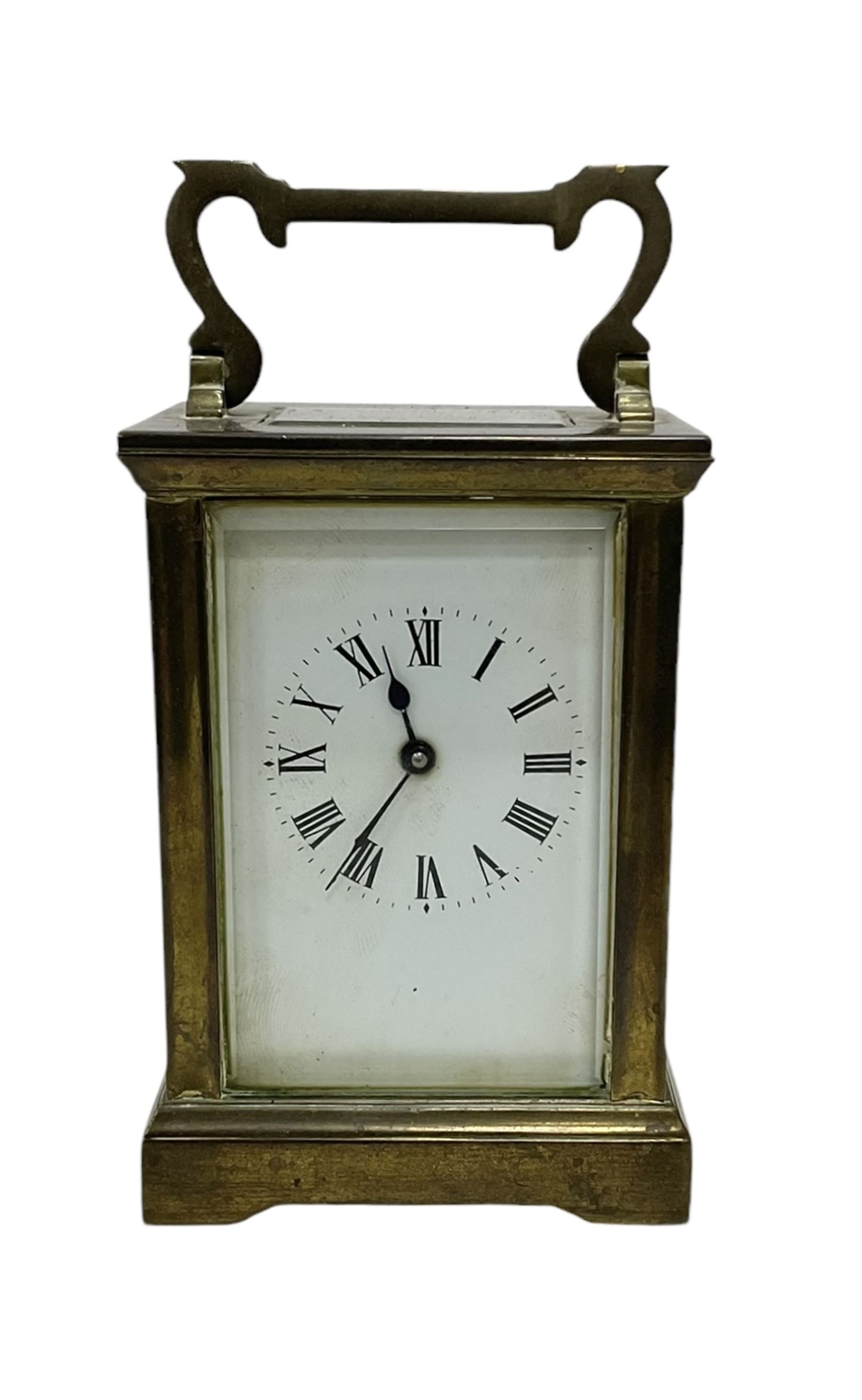 French - late 19th century 8-day timepiece carriage clock in an Anglaise case with carrying handle and rectangular bevelled glass panels, enamel dial with Roman numerals and steel spade hands, with a lever platform escapement, jewelled balance and timing screws. With key. 
