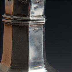 Edwardian silver sugar caster, of octagonal urn form, upon an octagonal foot, the removable pierced cover with urn finial, hallmarked Charles & George Asprey, London 1909, H21cm 