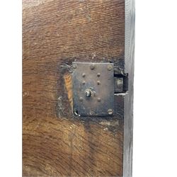 Late 17th century Flemish/Dutch rosewood and oak ‘Zeeuwse Kast’ or cupboard, projecting cornice carved with three putti masks, the uprights carved with lion masks over ribbons, flower heads and foliage, enclosed by four geometric panelled doors, lower central upright carved with flower head over foliate ribbon with bird among foliage, the escutcheon hidden by swivel berry carved cover, interior fitted with shelves, two drawers and shallow hinged cupboard, on two large turned and ebonised feet, circa 1680