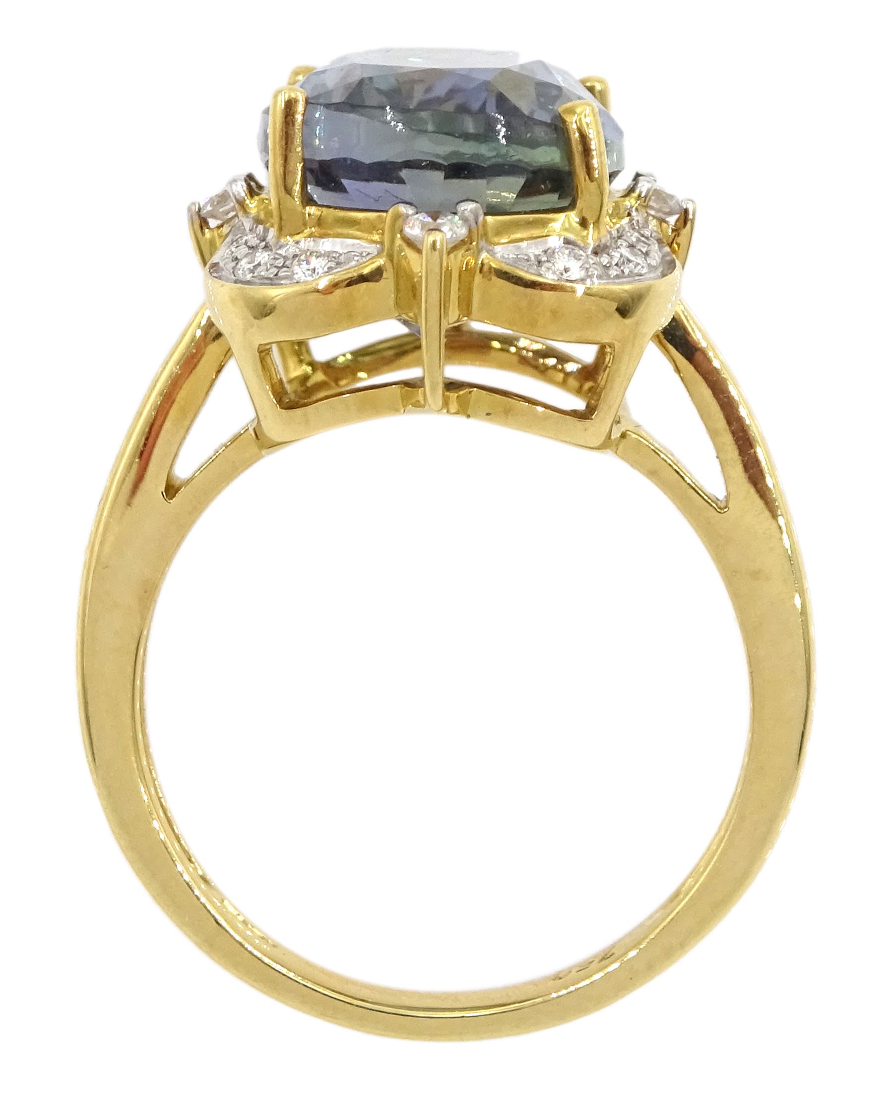 18ct gold oval cut fancy colour tanzanite and round brilliant cut diamond cluster ring, hallmarked, tanzanite approx 9.00 carat