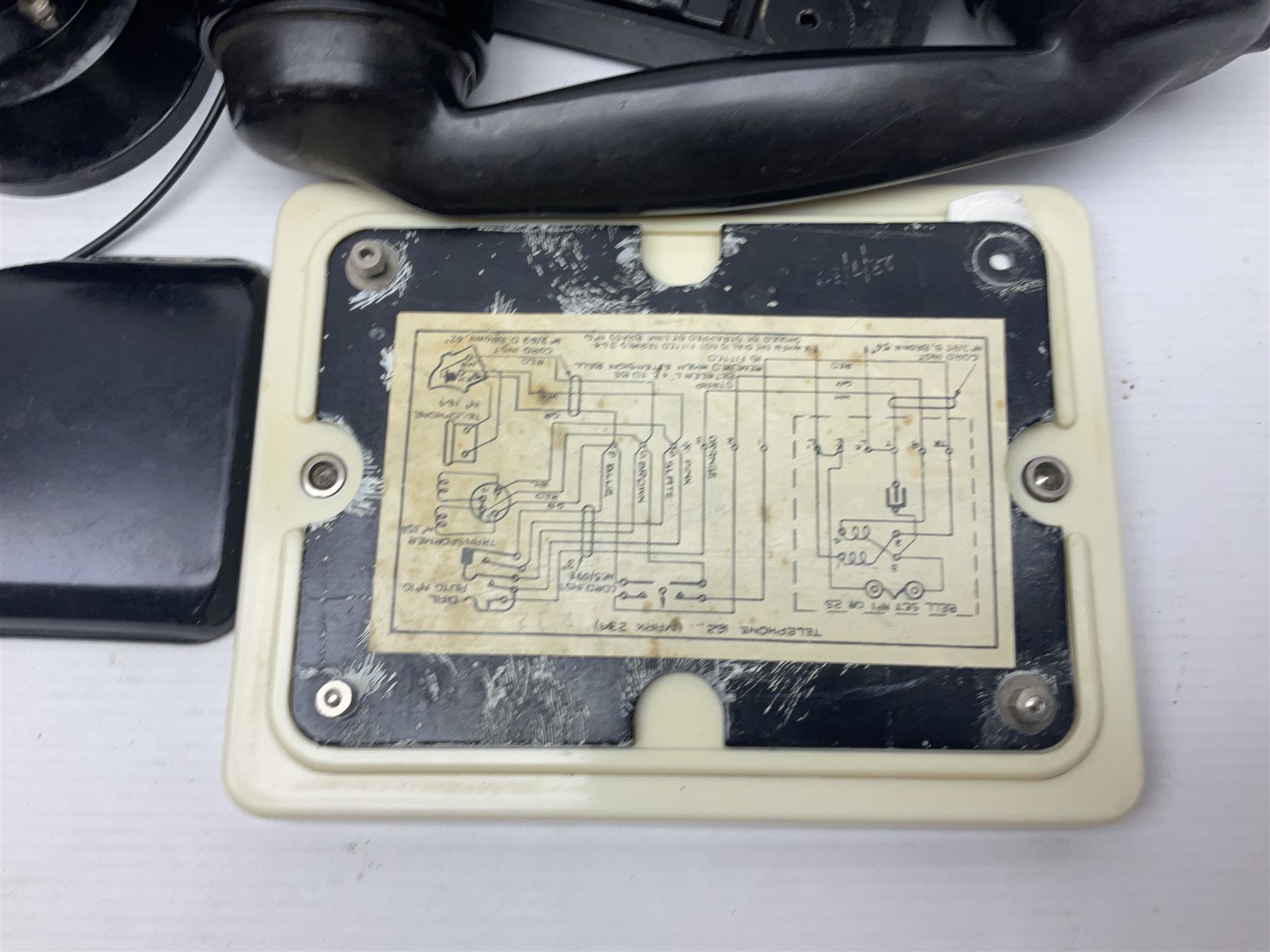 Collection of phone headsets, including GPO bakelite examples, together with other telephone parts 