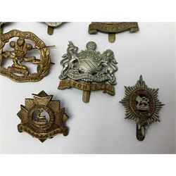 Seventeen regimental cap badges including Dorsetshire, Worcestershire, Staffordshire, Lancashire, Manchester, Middlesex, Berkshire, Bedfordshire etc (17)