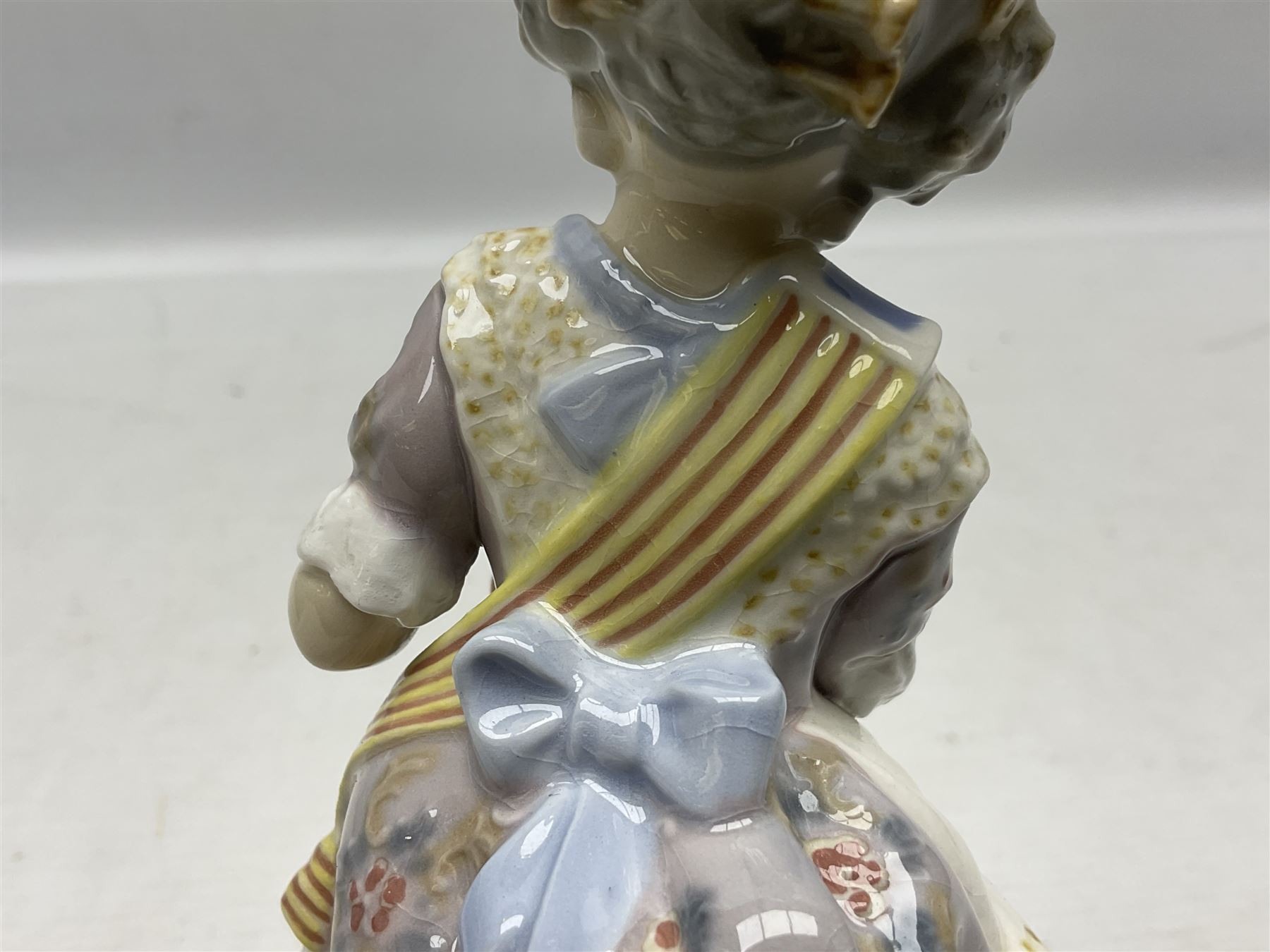Lladro figure, Miss Valencia, modelled in traditional Valencian dress with basket of oranges, sculpted by Juan Huerta, with original box, no 1422, year issued 1982, year retired 1997, H18cm