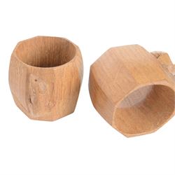 Mouseman - pair of oak napkin rings, of bulbous octagonal form, with carved mouse signature, by the workshop of Robert Thompson, Kilburn, W4.5cm