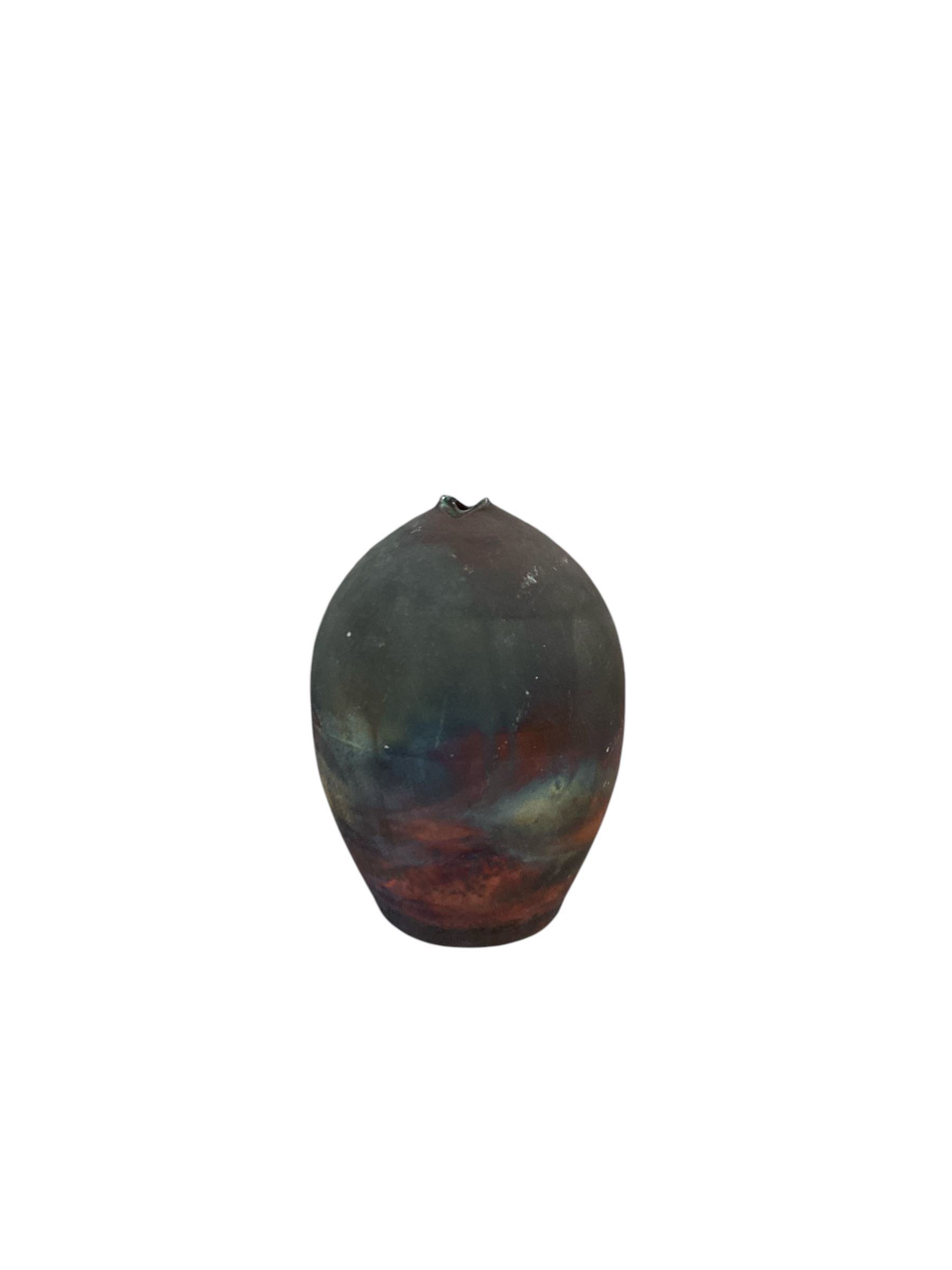 Raku fired studio pottery baluster vase, having copper fumed surface, signed to base, H22cm