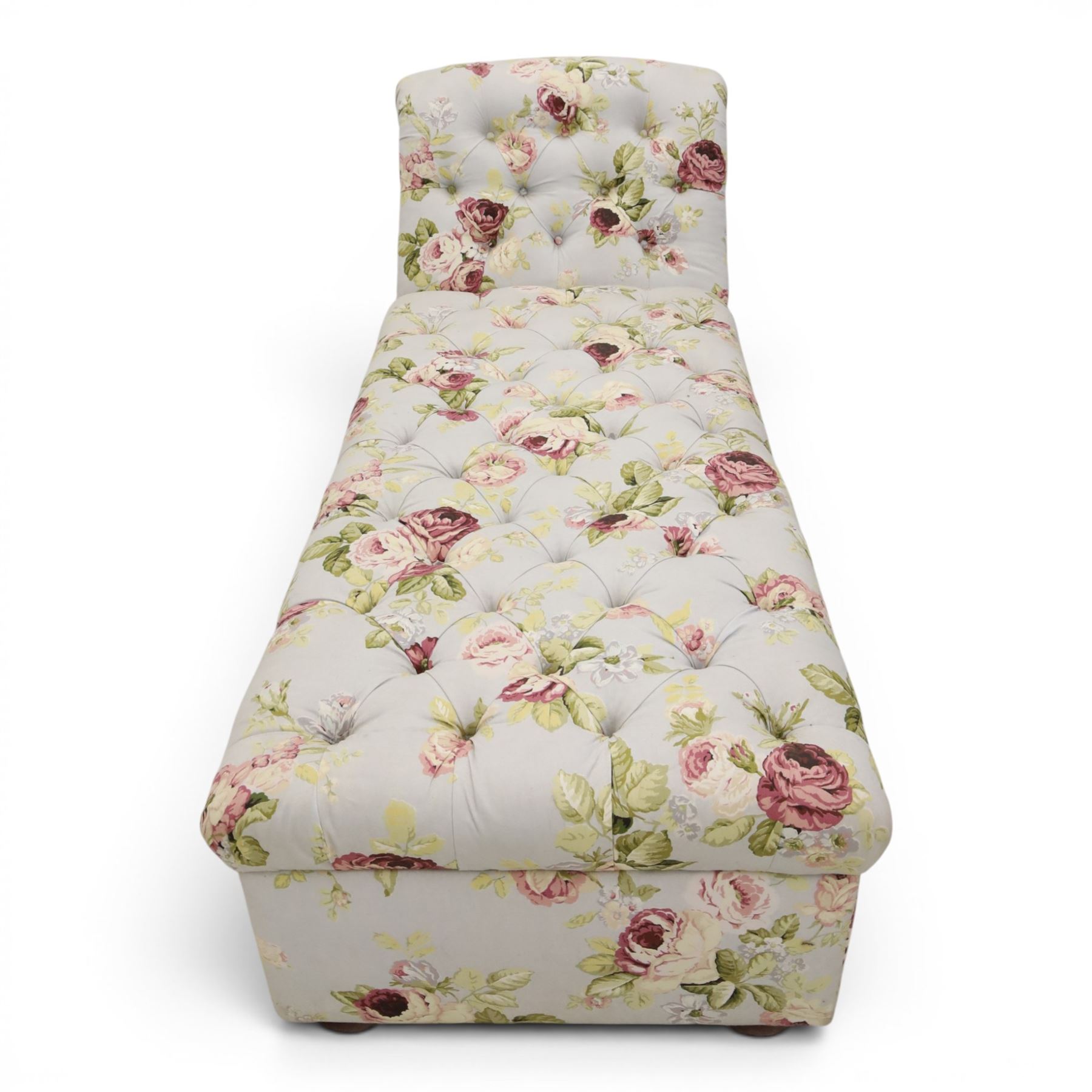 Traditional design scroll end chaise longue Ottoman, floral upholstered buttoned seat hinged to reveal a red lined interior, with reclining scroll end, raised upon squat bun feet