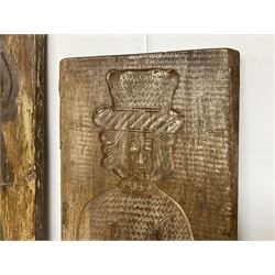 Two 20th century hardwood Dutch folk art Speculaasplank or biscuit moulds, typically carved with figures in traditional dress, largest H101cm