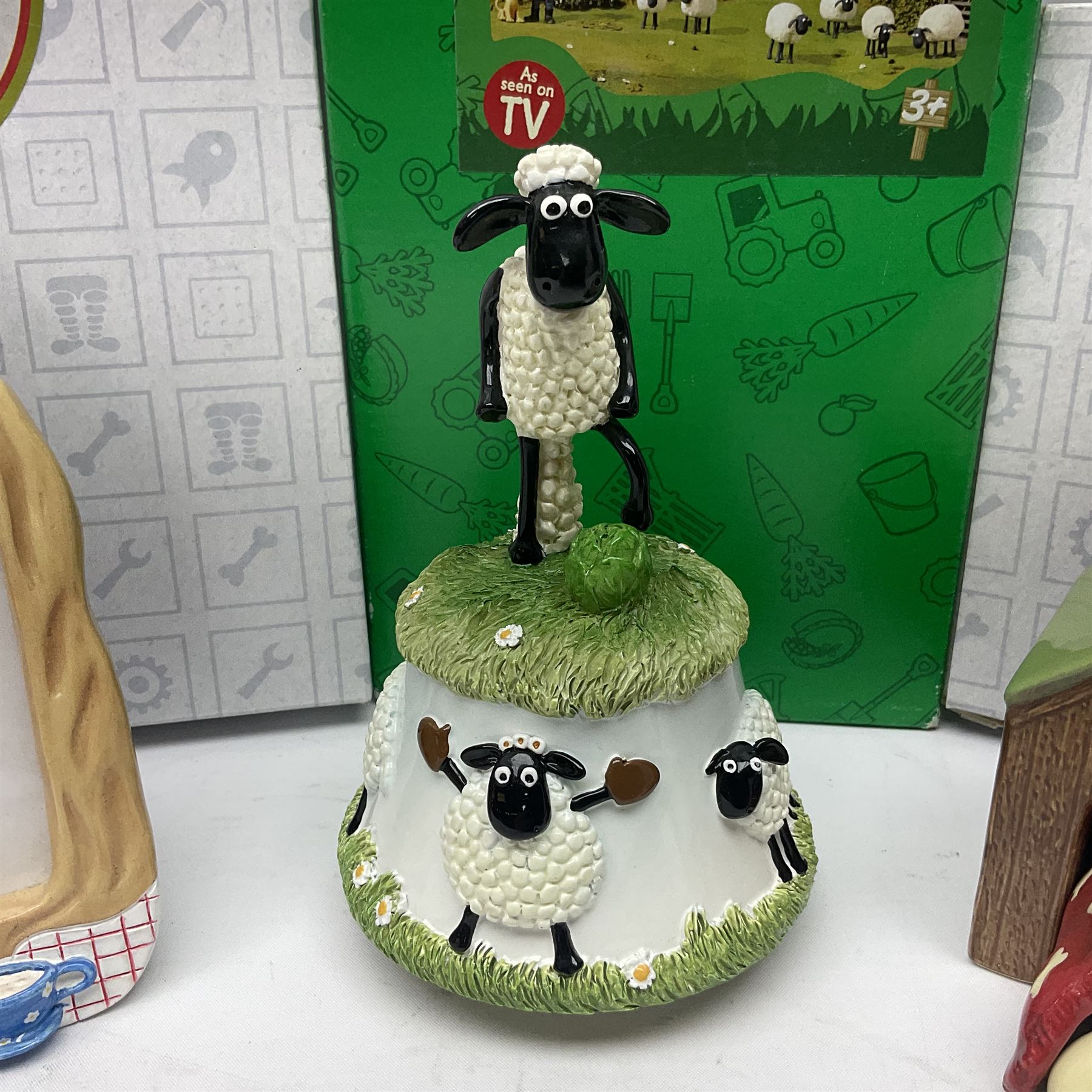 Border Fine Arts Shaun The Sheep Tractor Train and musical figure, together with a Wallace and Gromit photograph frame and a Gromit cruet sett, three in original boxes  