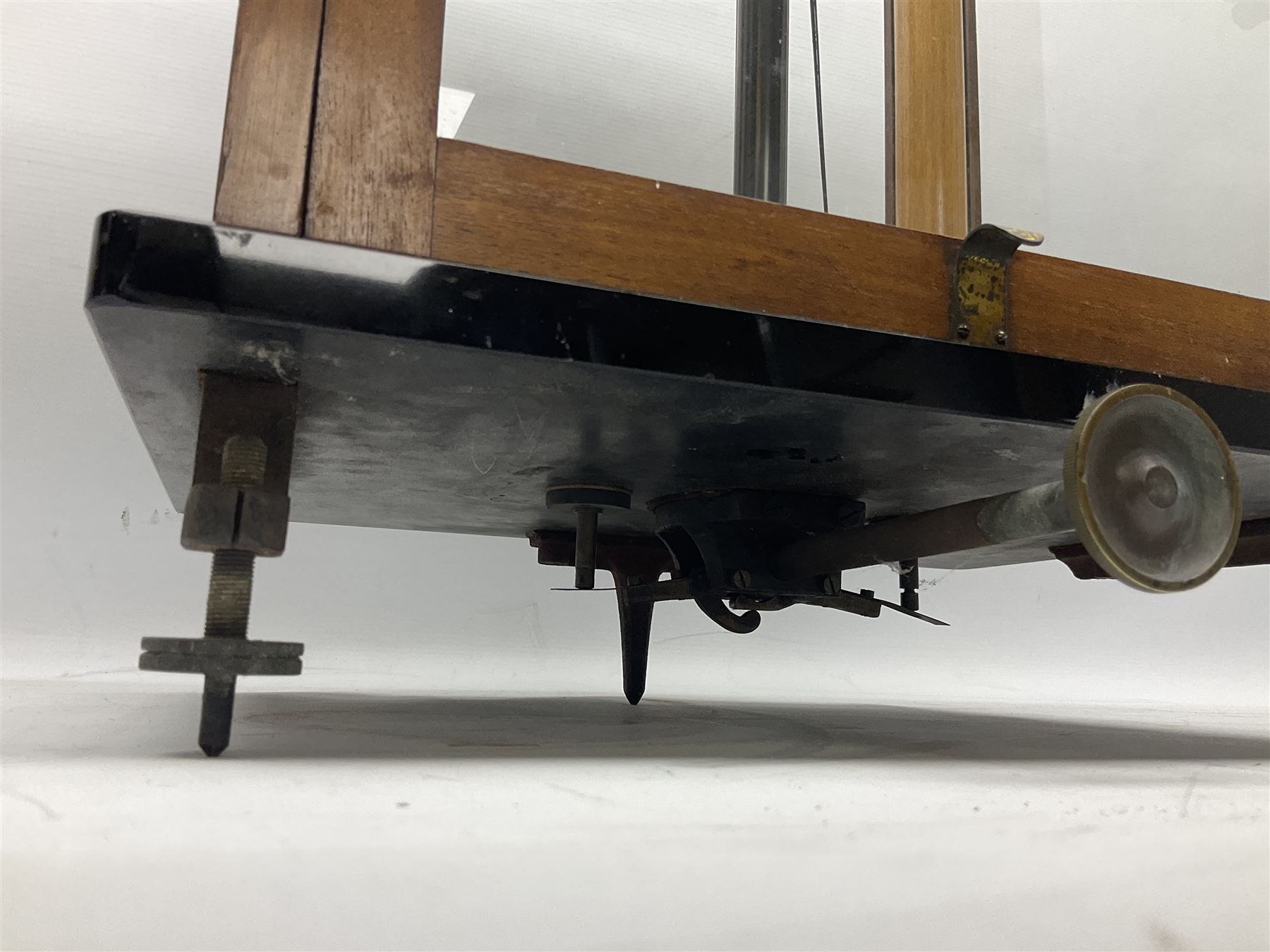 Set of laboratory balance scales by Reynolds & Branson of Leeds in fully glazed mahogany case with rise-and-fall front door, black vitrolite base with brass feet and hand cranked action L40cm H51.5cm D30cm; and bakelite cased set of brass weights