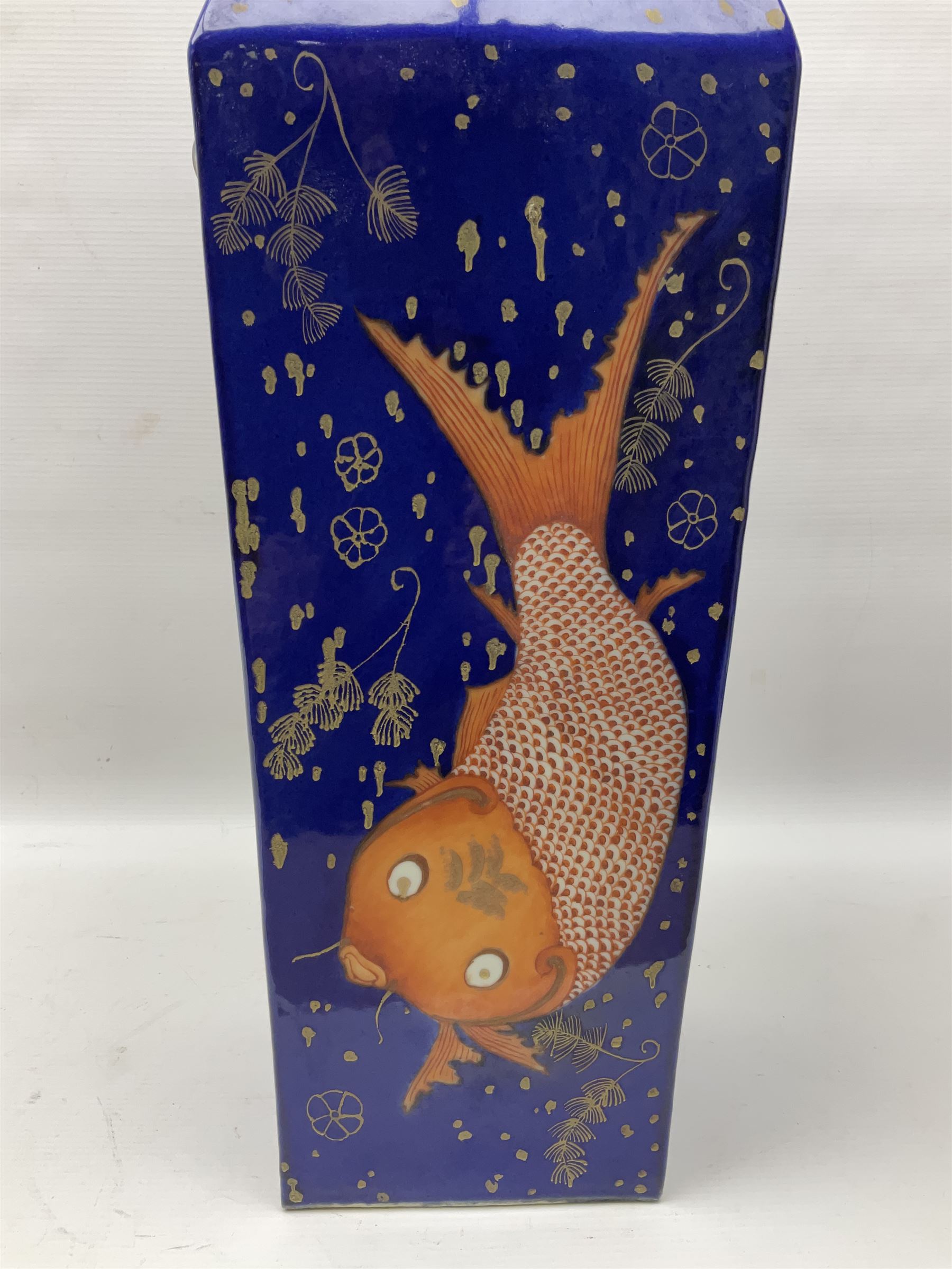 19th/ early 20th century Chinese powder blue vase, square section form with twin mask handles, painted in iron red and gilt with carp amongst aquatic weeds, Daoguang iron red seal mark beneath, H57cm 