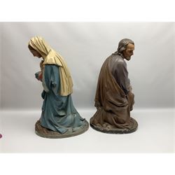 Two religious painted plaster figures of Mary and Joseph kneeling on oval plinths, with impressed mark 'Raffl et Cie Paris', H60cm 