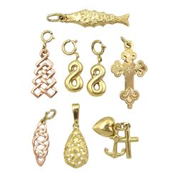 Eight gold charms including engraved cross set with single diamond, rose gold Celtic designs, infinity symbols and fish, all hallmarked or tested 9ct 