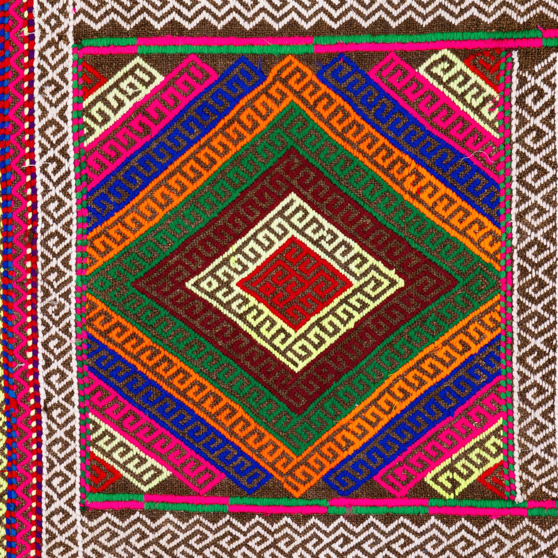 Afghan Suzni flatweave geometric design runner rug, decorated with trailing lozenges decorated with hooked motifs, within zig-zag bands, bright multi-coloured ground ivory and brown geometric main border