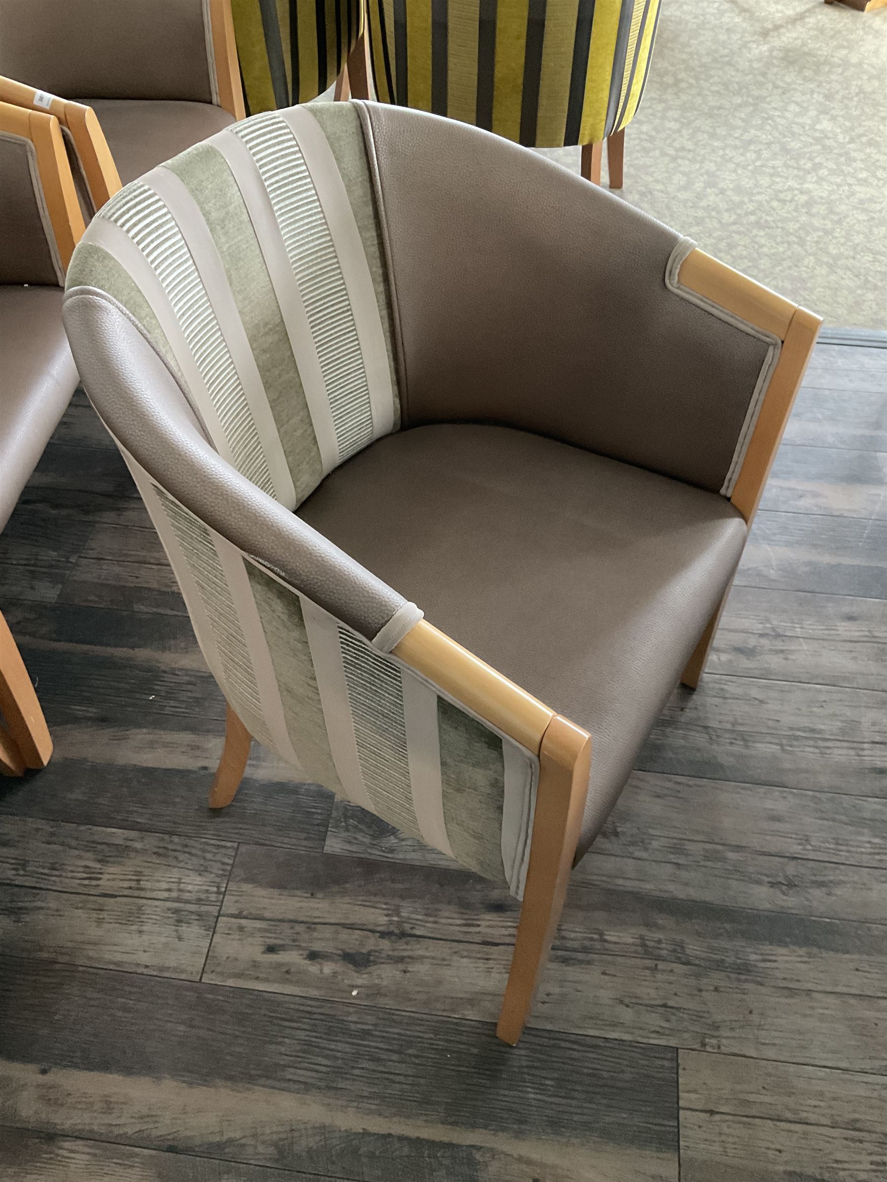 Seven tub shaped armchairs, beech framed, bronze and pattern cover- LOT SUBJECT TO VAT ON THE HAMMER PRICE - To be collected by appointment from The Ambassador Hotel, 36-38 Esplanade, Scarborough YO11 2AY. ALL GOODS MUST BE REMOVED BY WEDNESDAY 15TH JUNE.