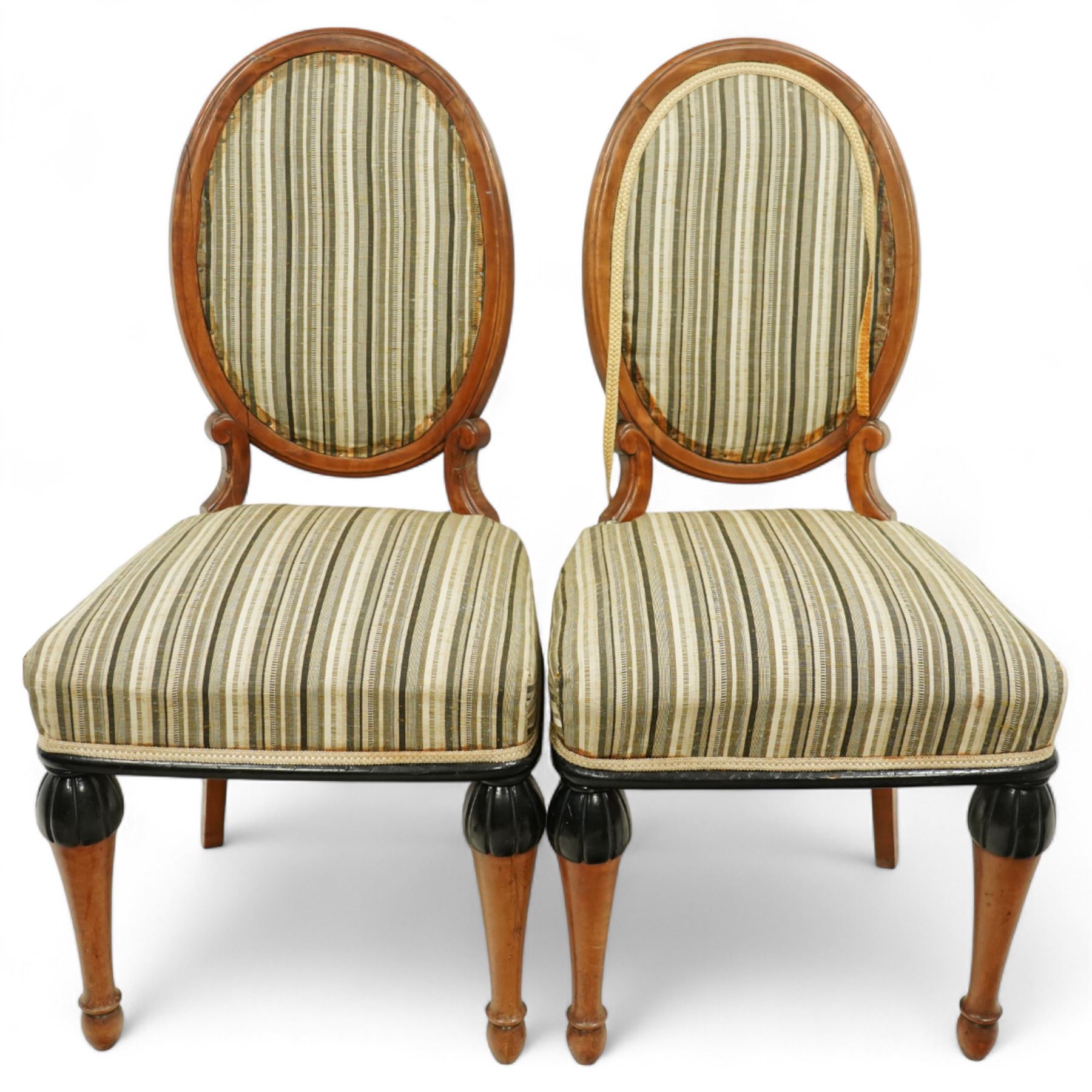 Mid-20th-century Biedermeier-style ebonized and satinwood pedestal table, quarter-veneered circular top with ebonized edge above a tapered baluster quarter-lobed column, raised on a circular plinth base, D87xH70cm, together with two matching upholstered spoon back chairs W45xD47xH87cm